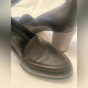 Fendi black leather loafer with gray block heel.